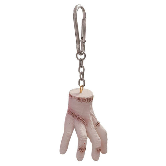 Keychain in the shape of a hand with a gold ring on a white background