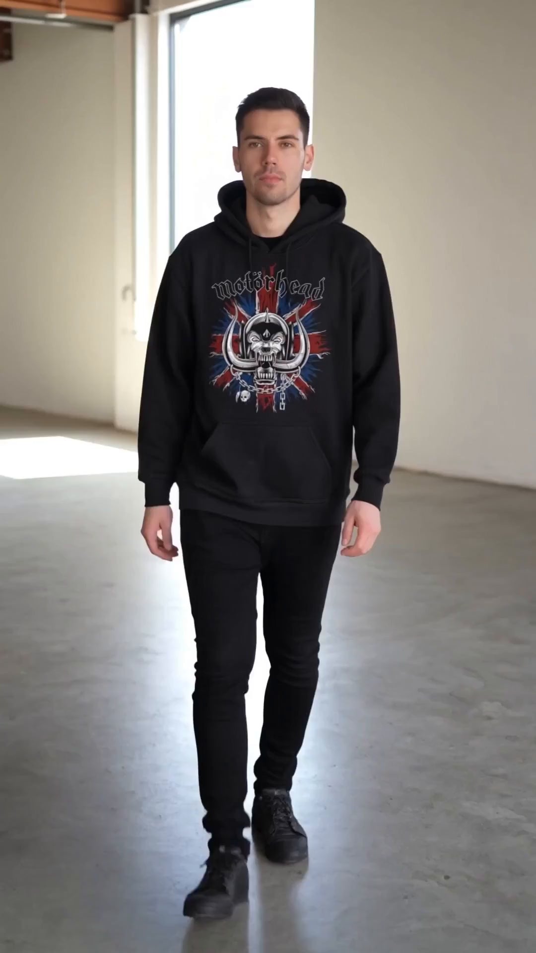 Load video: model wearing a black motorhead hoodie with their Warpig logo on a Union Flag Background printed on the front